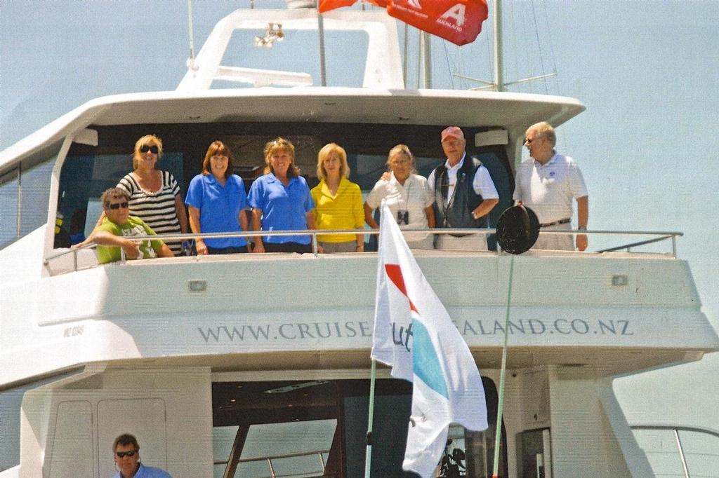 Terry and Mary Kohler and friends in Auckland, and flying the Southern Spars flag © Peter Montgomery